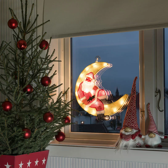 Siluett tomte liggande i måne 20 LED 2860 Konstsmide